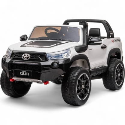 Carro Elétrico para Criança Toyota Hilux Branco 12v 4x4 c/ Rodas de Borracha & Assento em Pele