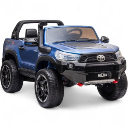 Carro Elétrico para Criança Toyota Hilux Azul Metalizado 12v 4x4 c/ Rodas de Borracha & Assento em Pele